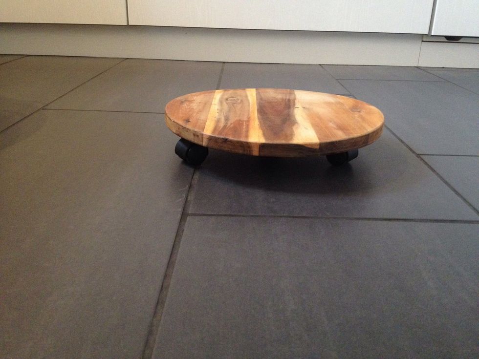 Get yourself a plant stand on wheels (LANTLIV from IKEA or any other stand with a diameter of 30cm (11 \u00be "))