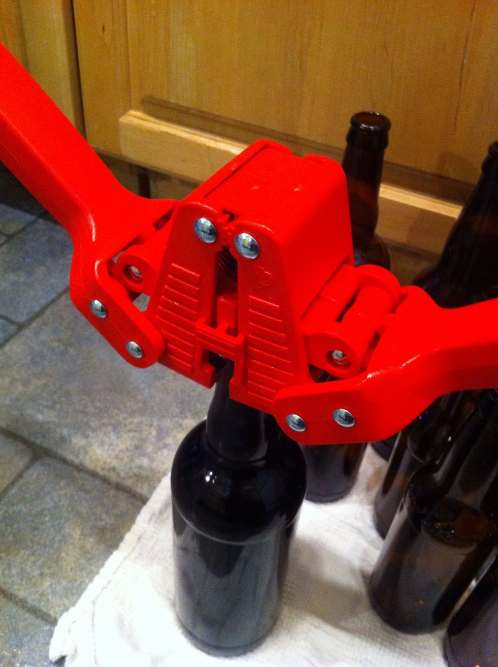 getting above the bottle during this step is going to help you a lot. put just enough pressure to push the handles about level with the ground. you don't need a lot of force to do this. do you feel it