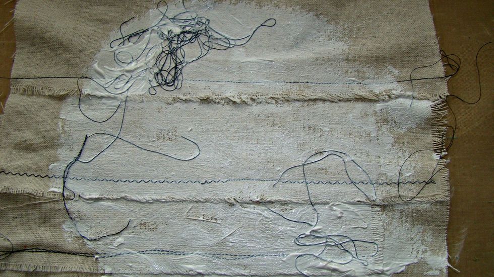 Give a coat of clear gesso to prep your muslin for paint and ink mediums. For interest keep all the loose threads on the muslin and gesso right on top of them.