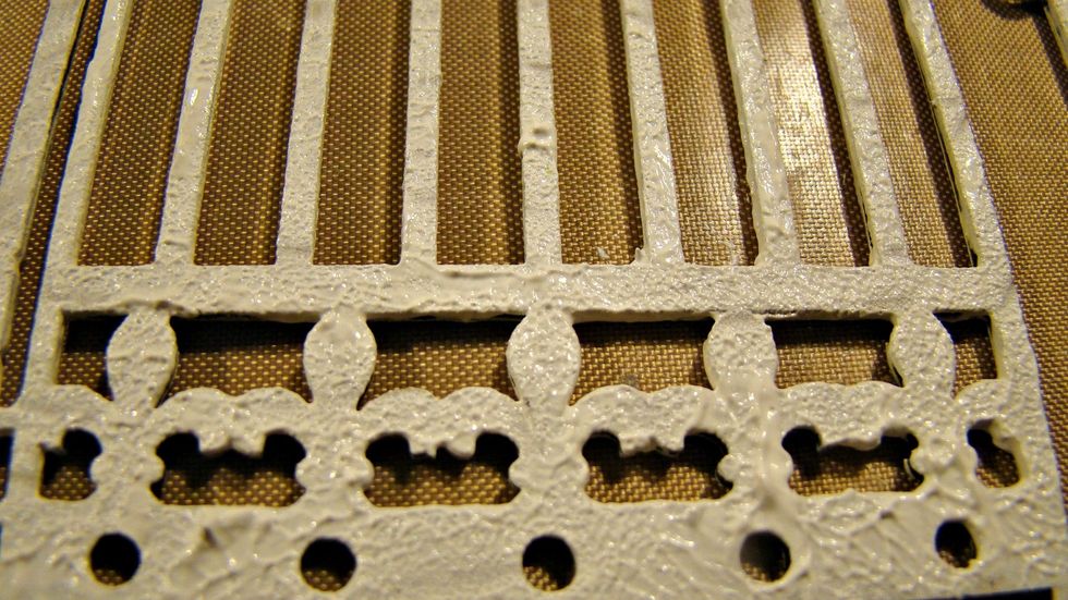 Give a couple coats to your chipboard pieces of white gesso and use a sponge to provide more texture once dried.