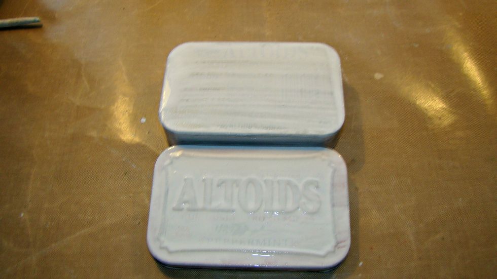 Give it a coat of gesso to prep the surface. Allow to dry