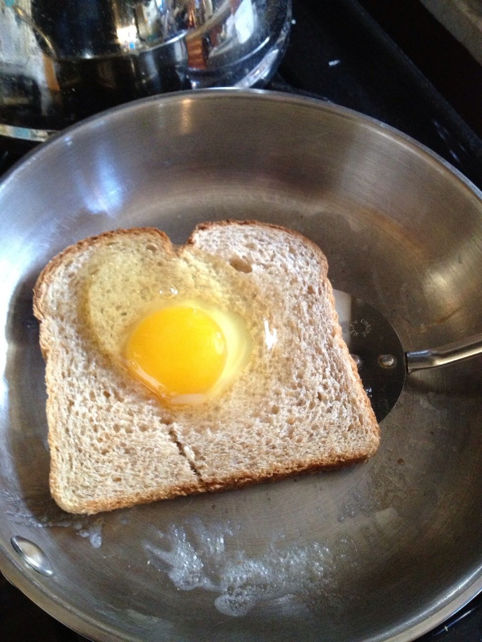 Give it a few minutes then carefully put your spatula under the bread. Push the toast with your hand to help get the spatula under it more easily.