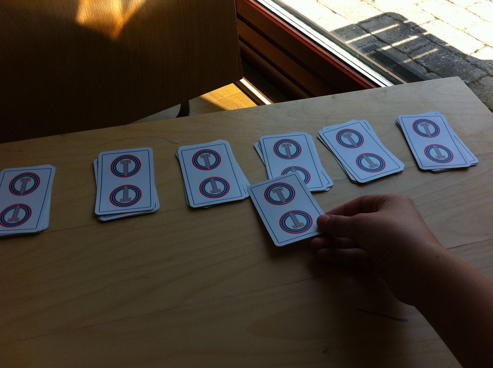 Give out six piles of four to each person.(note; only two players.)