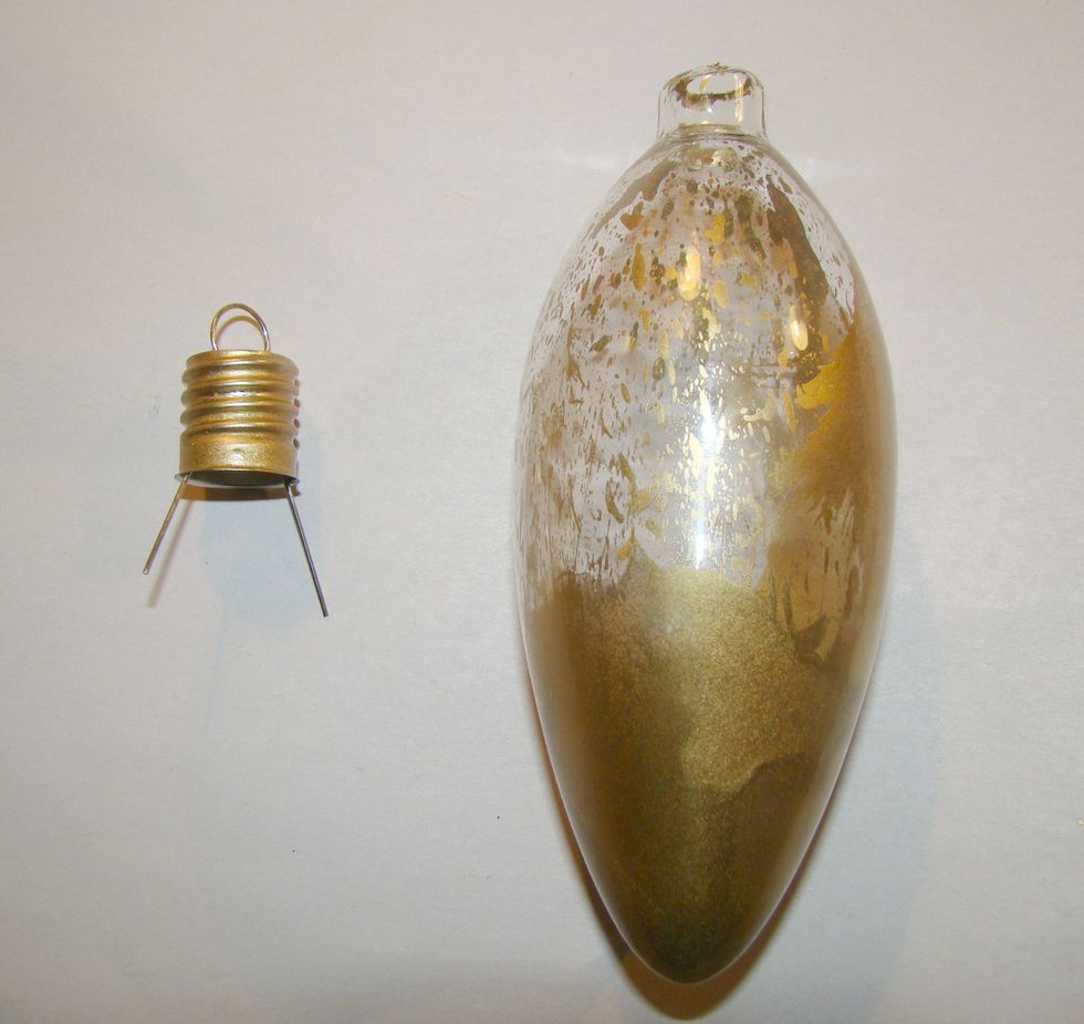 Give several puffs of air inside the ornament to move your alcohol inks around. You can always add more ink if you like, so start of with just a few drops. I wanted a splattered look on mine.