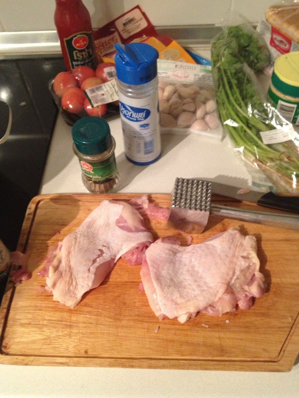Give the chicken a light smash there to make them super dooper soft. Then season with salt and pepper.