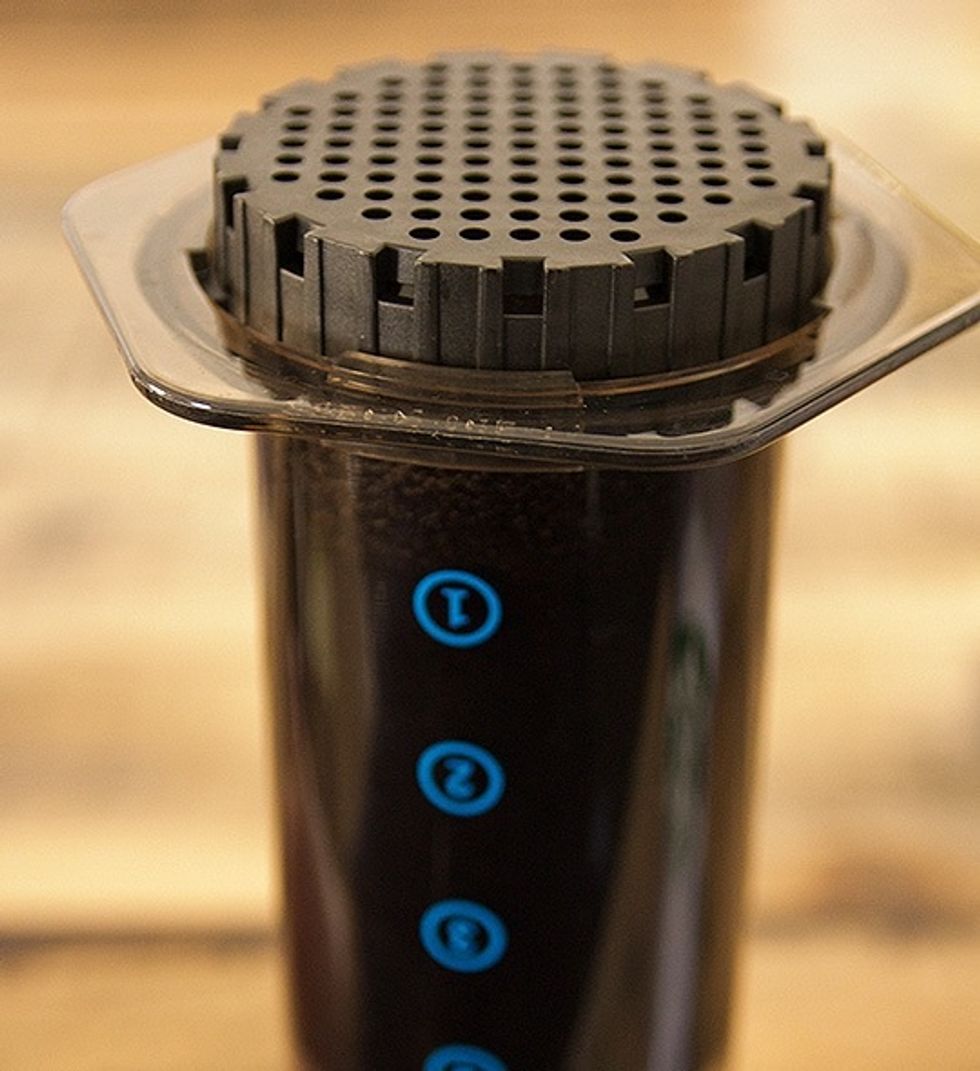 Give the mix one more stir, then screw on your filter and grate to the AeroPress.