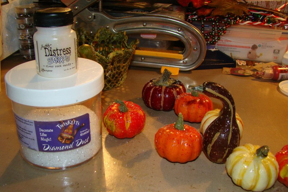 Give your gourds and pumpkins a hefty coat of Rock Candy Stickles and sprinkle Diamond Dust glitter on top for a pretty sparkle. Allow to dry completely.