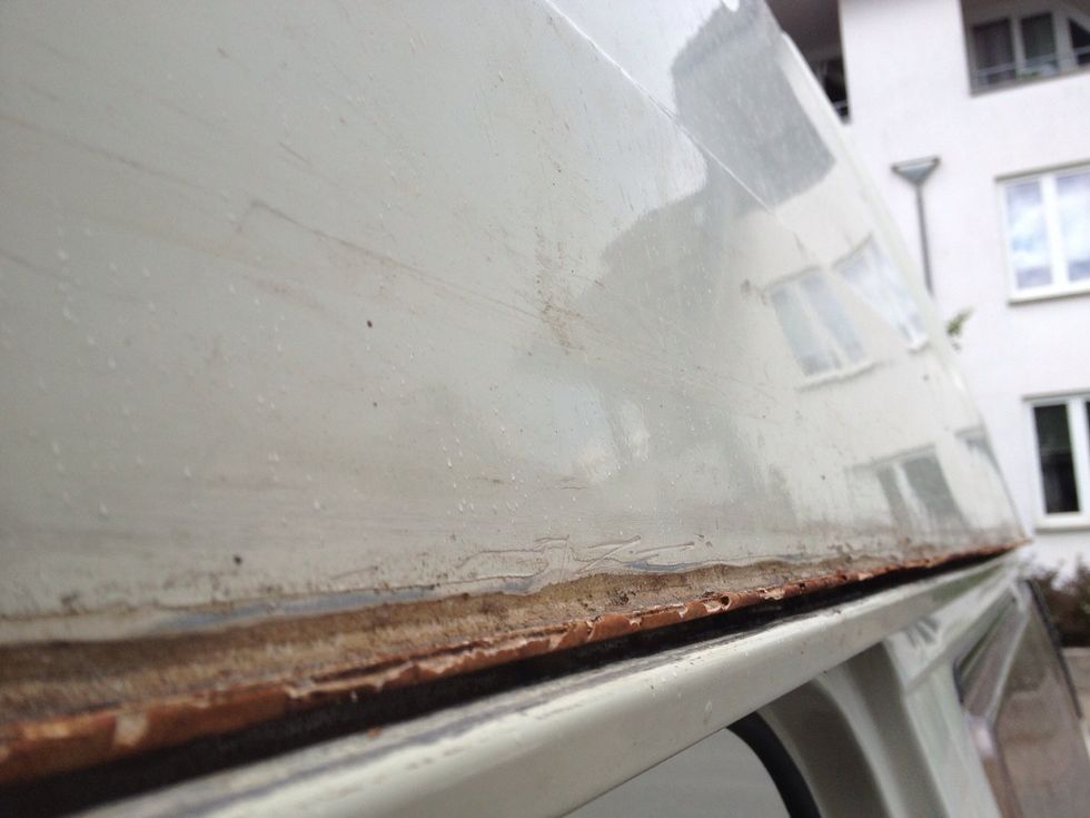 Give your roof a few punches with your flat hand and it will pop out of its position. Apply force but be gentle.