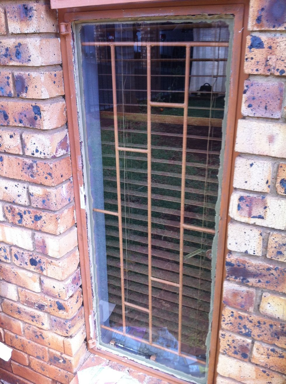 Glass put into frame against putty, and pushed in firmly. Careful not to break glass, push into frame along edges, and squeeze against putty.