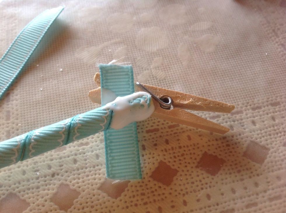 Glue 1 1/2 inch piece of ribbon on end, wrapping tightly.