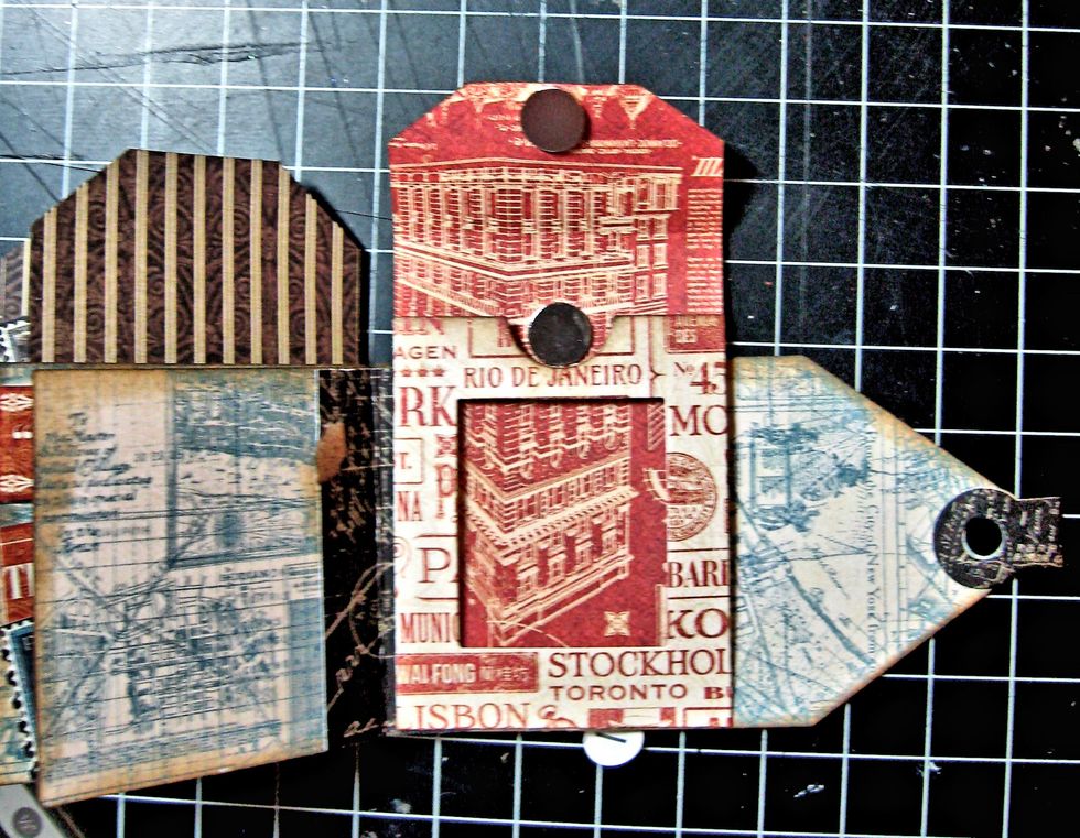 Glue 2 Basic Grey mini magnets in place as shown. Although the magnets come with an adhesive backing, it is not strong enough to hold the magnets in place, so I use glue.