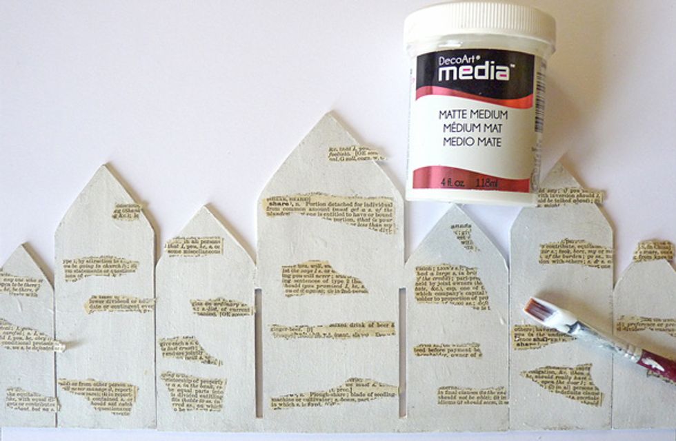 Glue a layer of gesso over them and then adhere torn pieces of dictionary paper using matte medium and seal everything over the top, leave to dry.