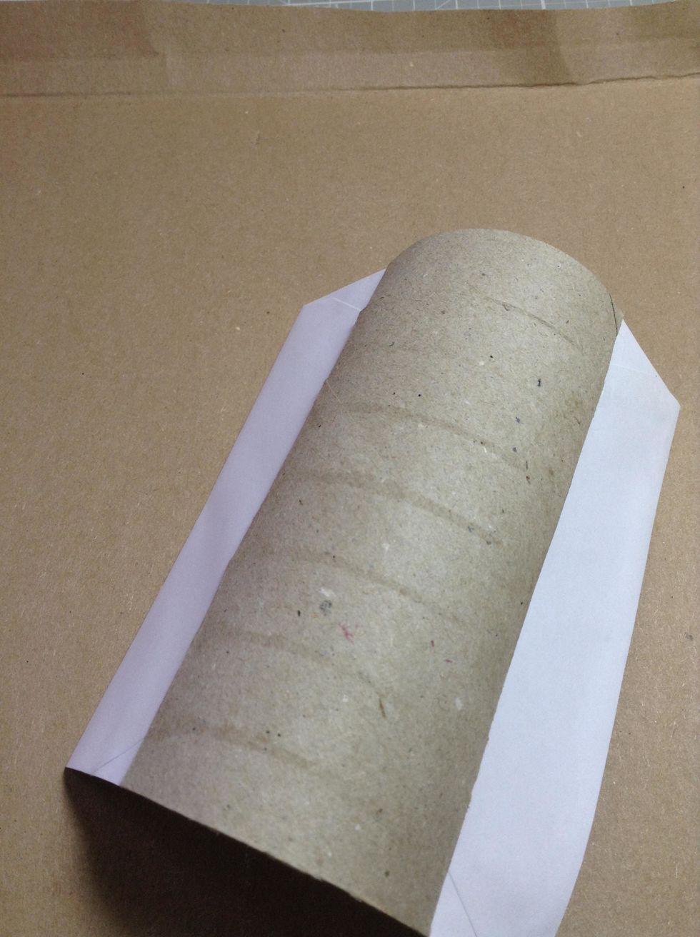 Glue a piece of white cardstock to the interior cardboard roll as shown.