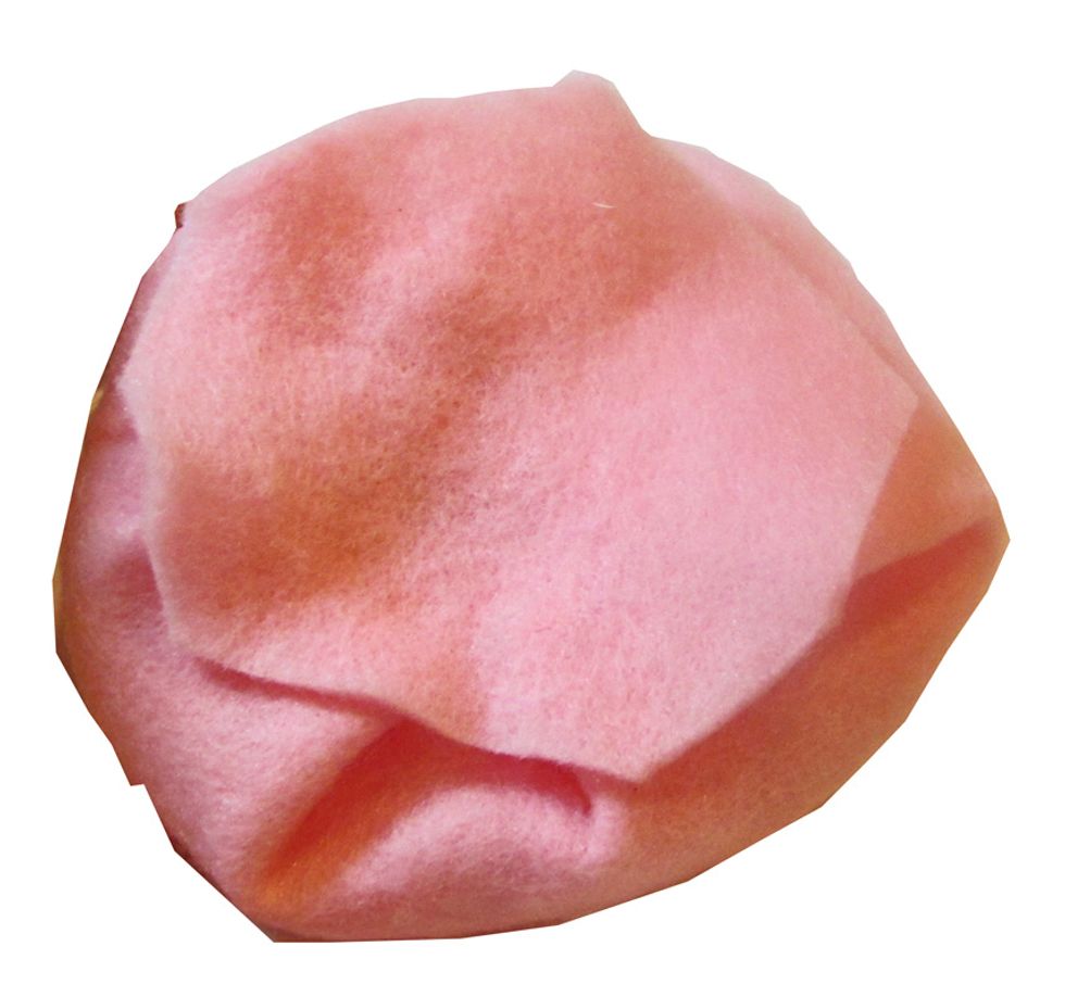 Glue a scrap of felt to the bottom to hold the flower together.