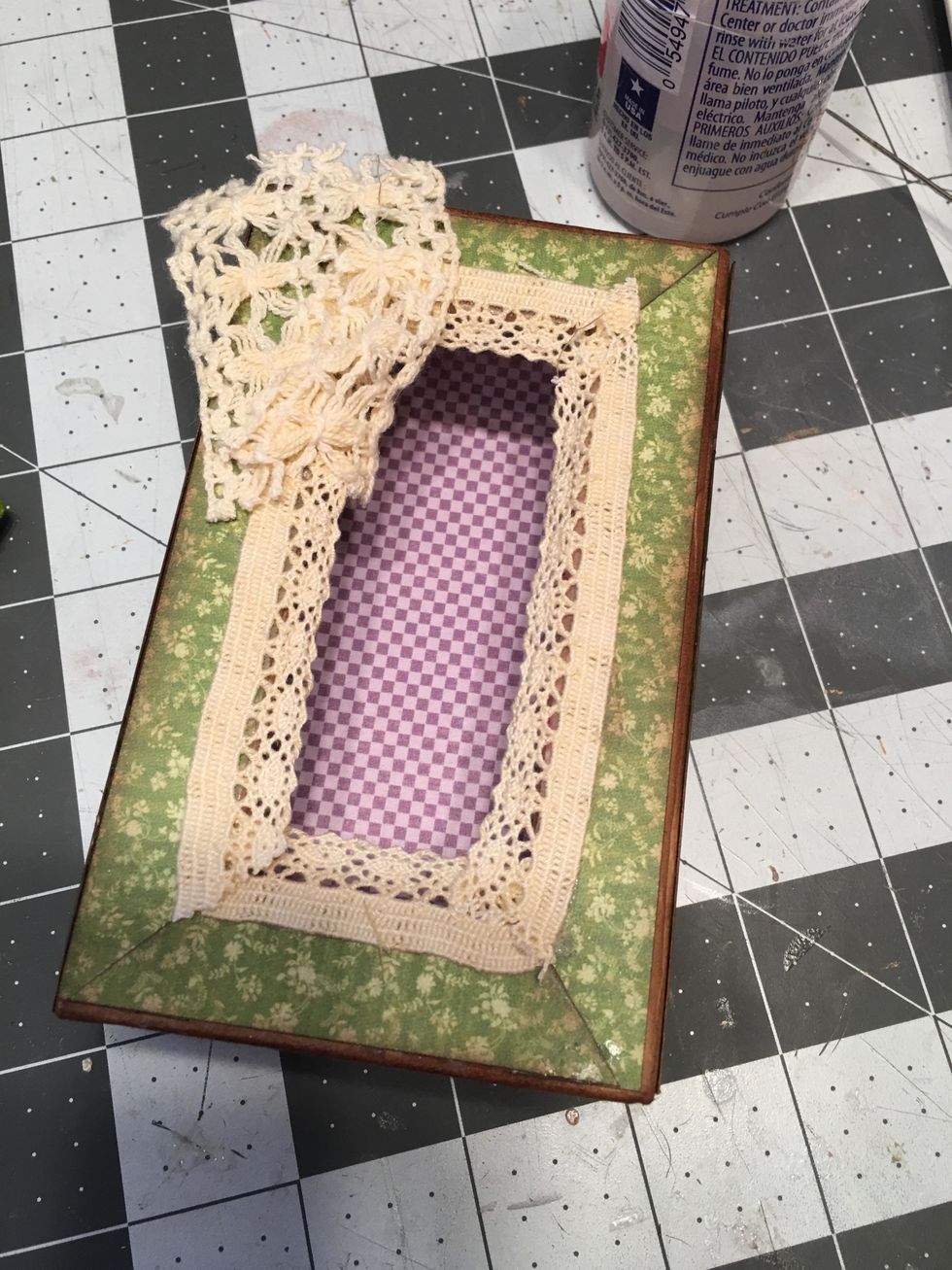 Glue a wide scrap piece of crochet lace to the upper left corner of the lid.