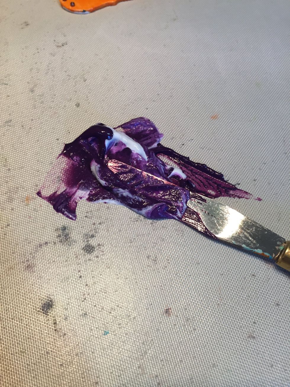 Glue being mixed with Mardi Gras.