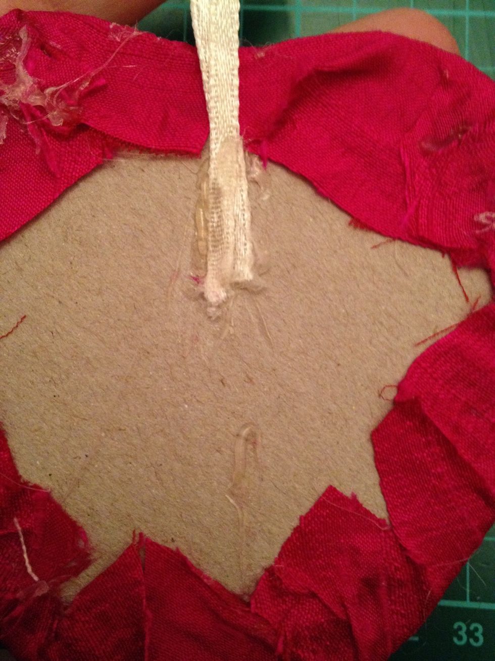 Glue but make sure it is in the middle so it will hang straight