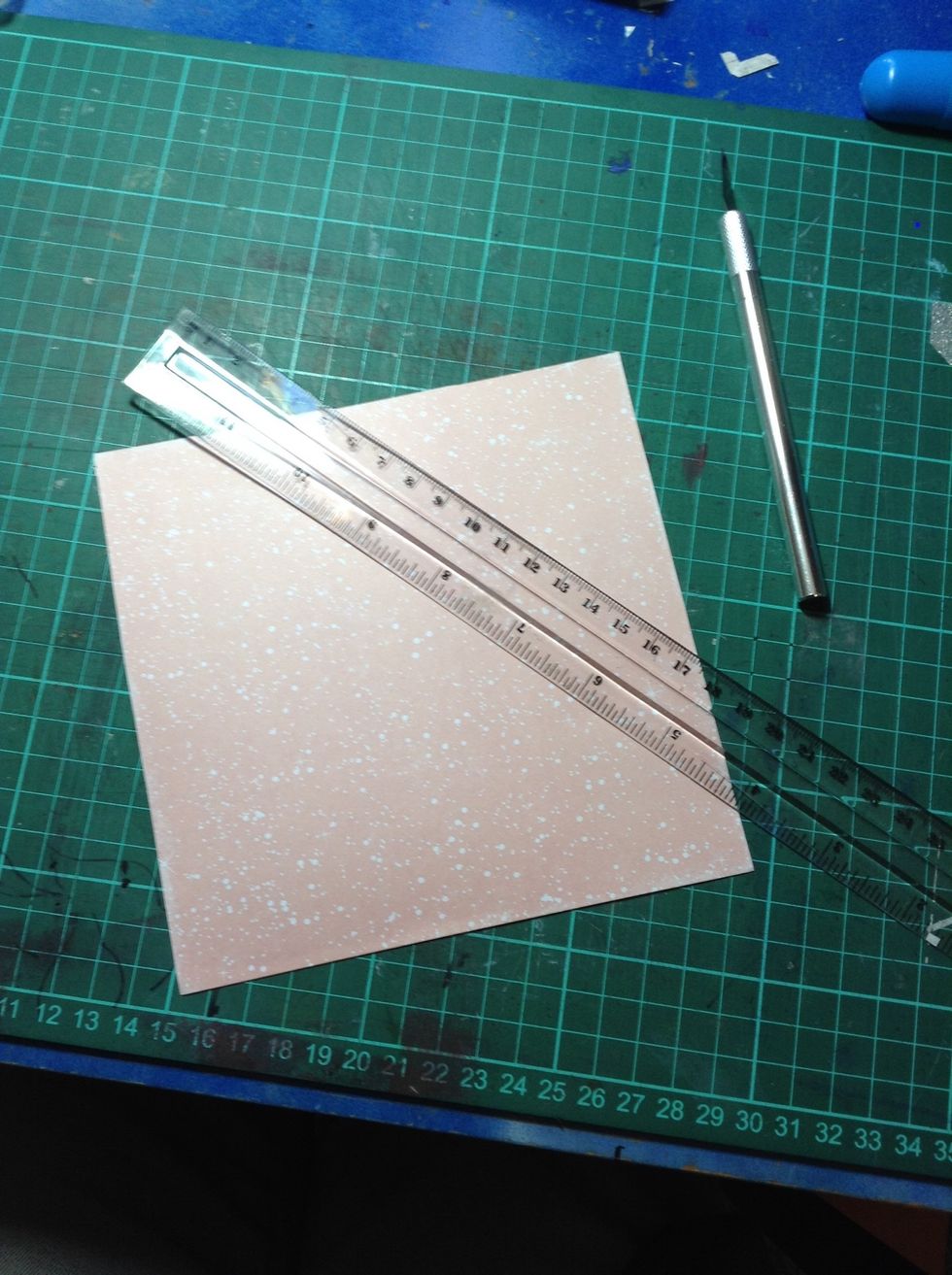 Glue card stock onto background colour paper and trim excess paper