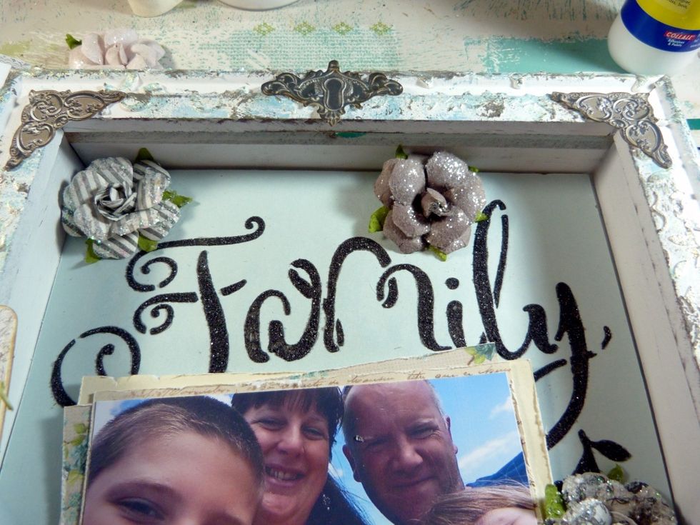 Glue corners onto the top corners of the shadow box and the keyhole in the centre at the top.