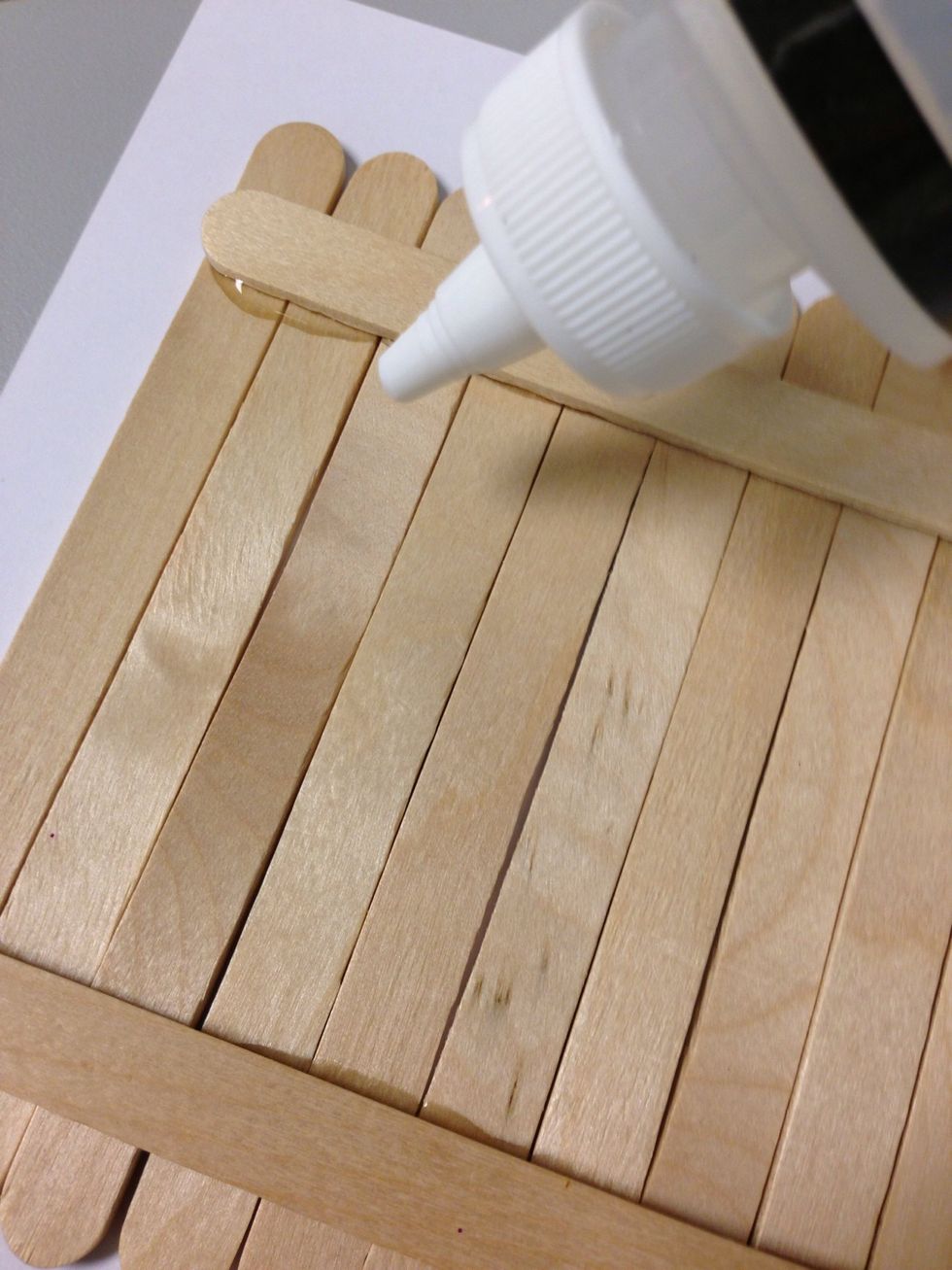 Glue craft sticks to the back - this will keep them all together