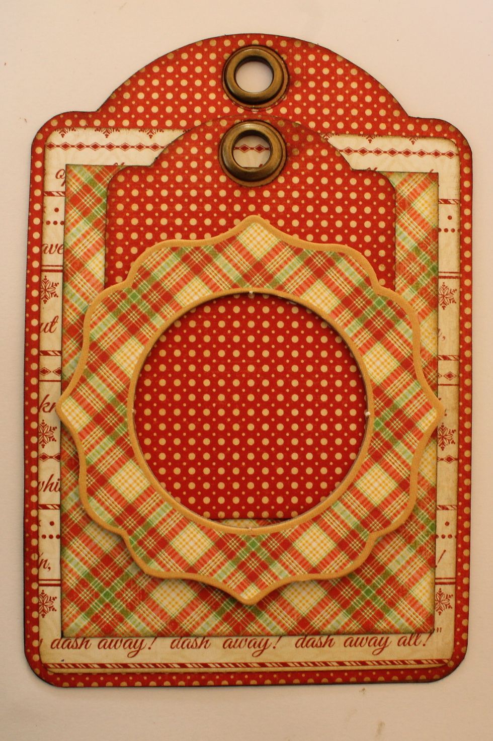 Glue down a chipboard frame onto the ATC tag.