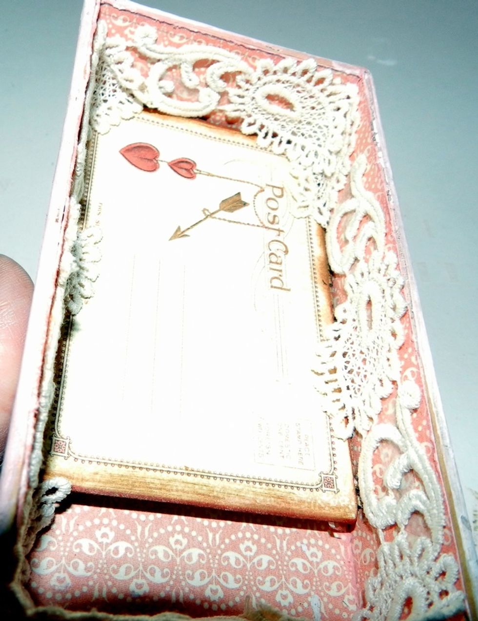 Glue down lace on the inner side of the box .