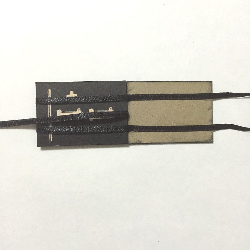 Glue down the 2 ribbons onto the 3rd number block as shown...