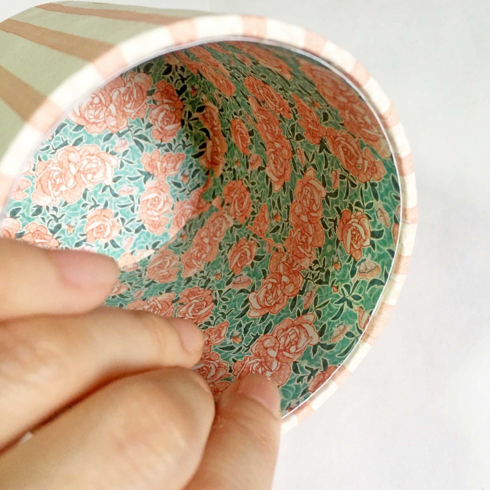 Glue down the pattern paper into the inside of the roll. You may want to trim the height a little to fit before gluing down.