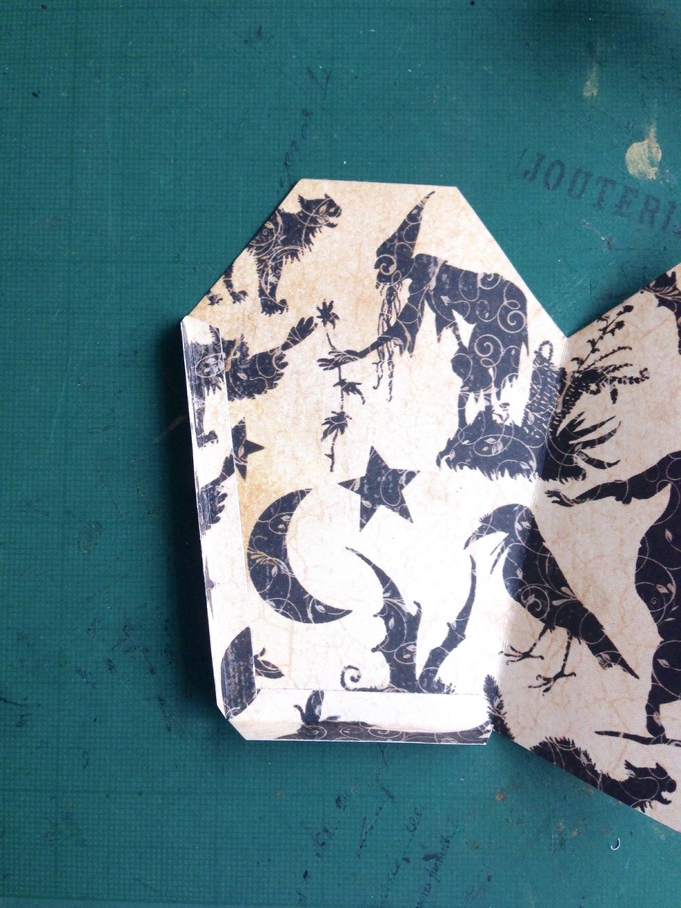 Glue down the strips onto the side as shown...