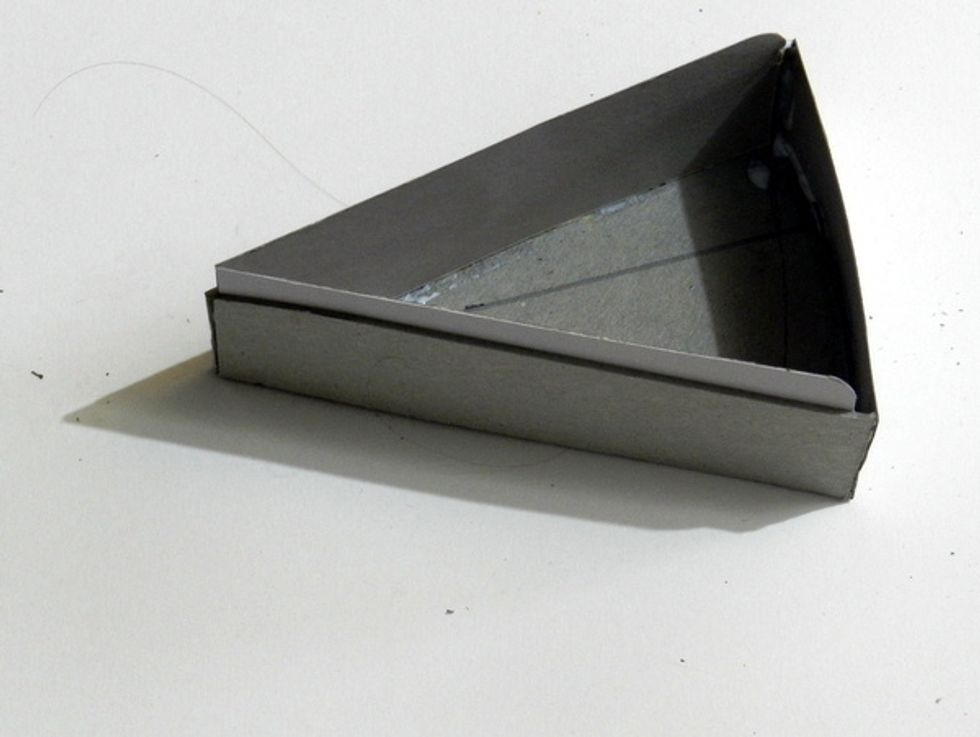 Glue down these two parts within the piece already assembled.