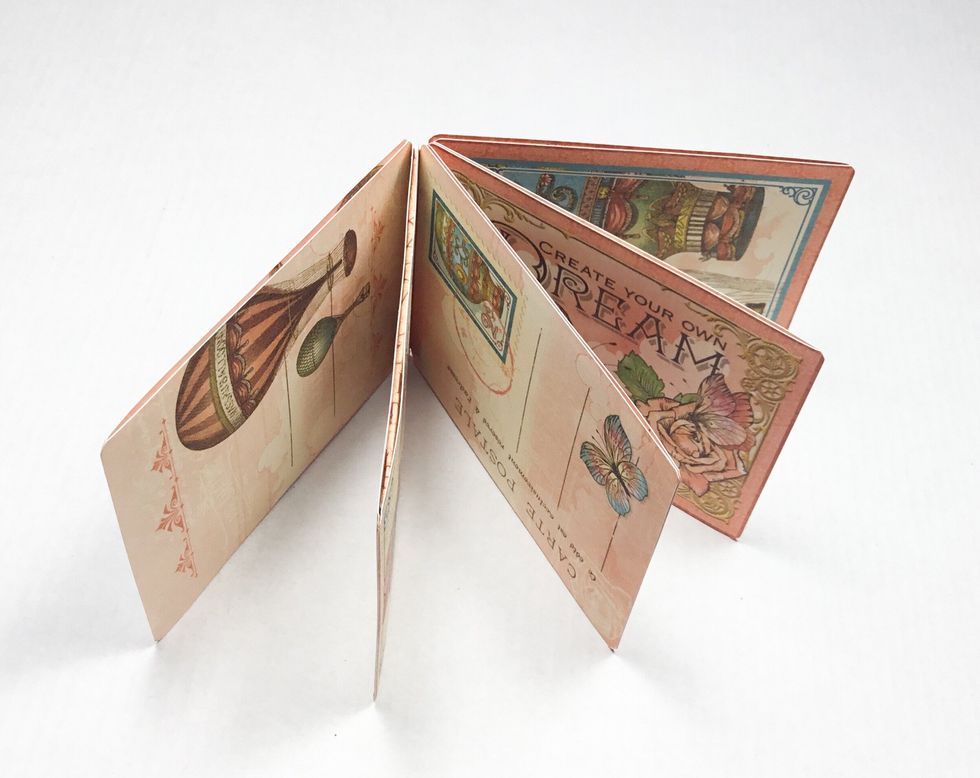 Glue down your ephemera cards to create the pages.