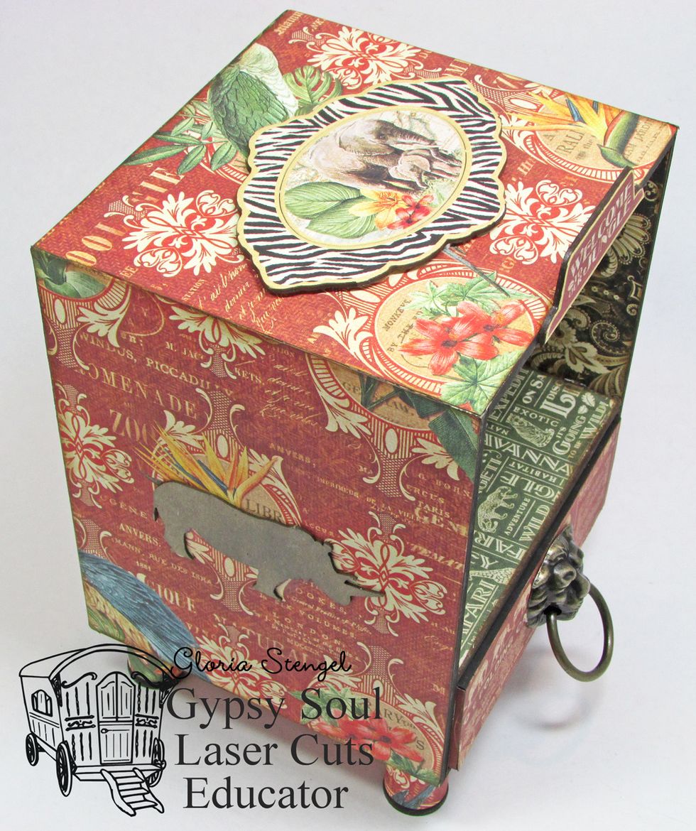 Glue GSLCuts Safari chipboard shapes to the box. Add Graphic 45 decorative chipboard as desired.