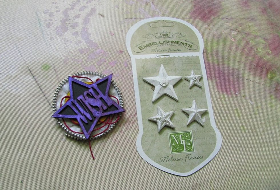 Glue it all together. I add a black background for the title and the twine behind the elements.  Prepare MF Resin Stars.