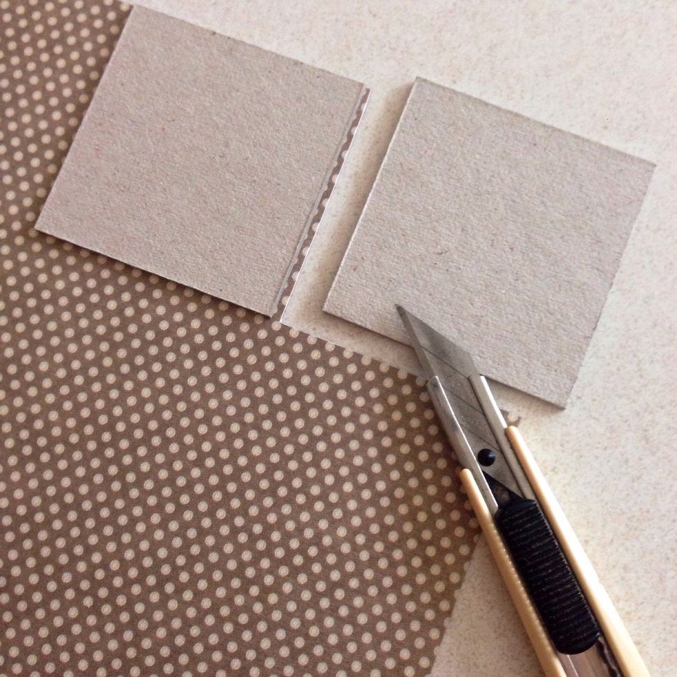 Glue it down onto a piece of pattern paper of your choice (on the wrong side)... Once glued down, trim the pattern paper accordingly to the chipboard size...