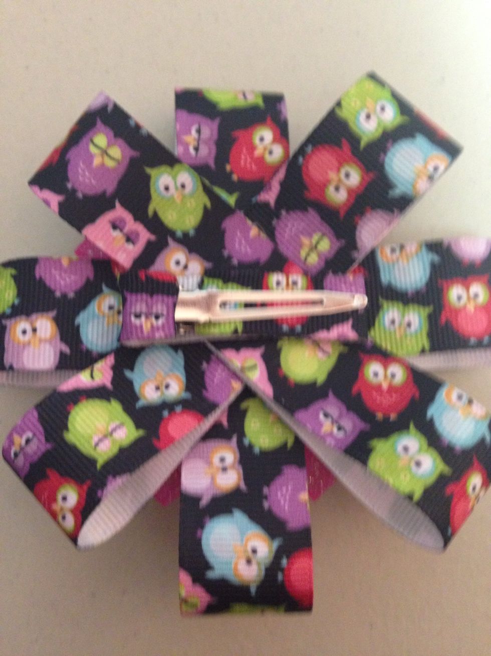 Glue it on the back, ribbon side