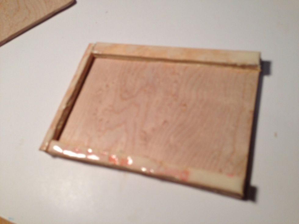 Glue on fingertips then the wood. Not too much.
