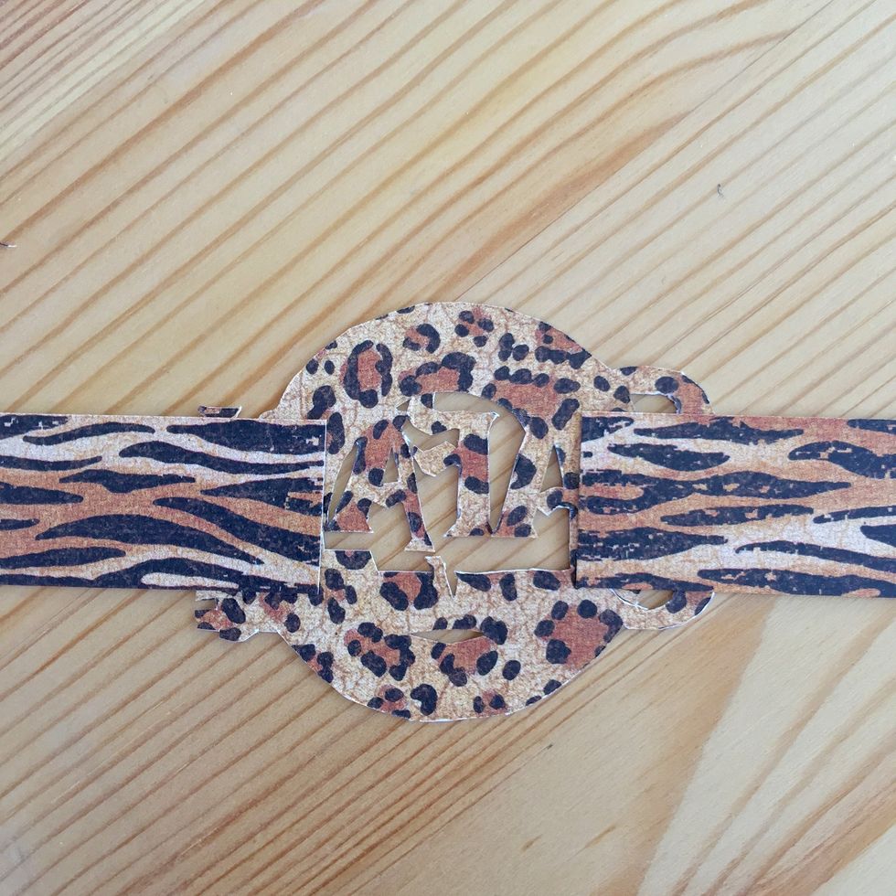 Glue on the back this two stripes.