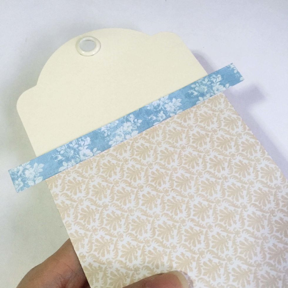 Glue on top of the tags as shown.