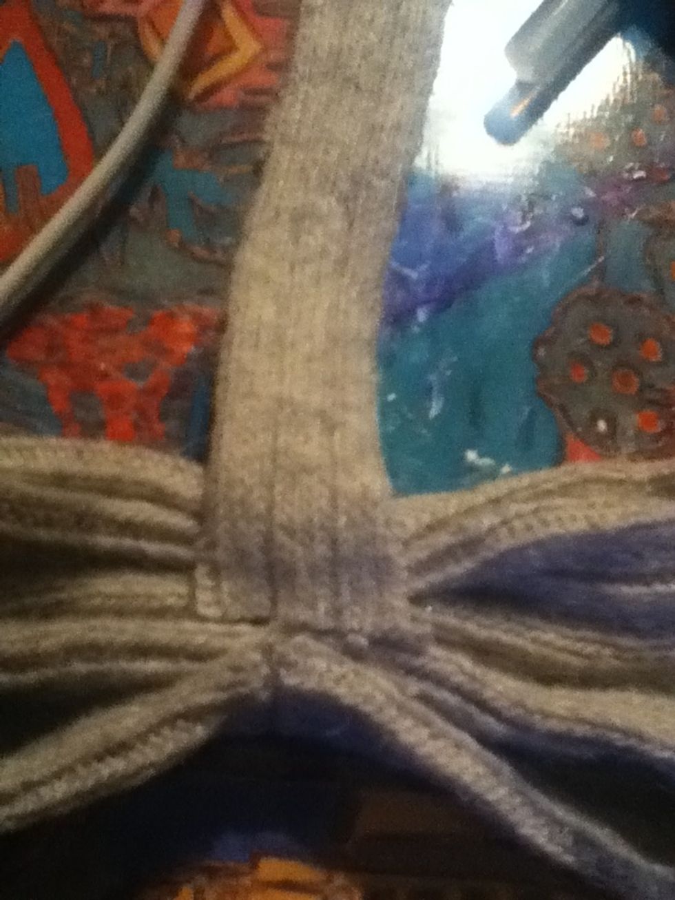 Glue one end of the smaller strip to the back of your bow
