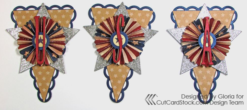 Glue one letter to the center of each rosette.