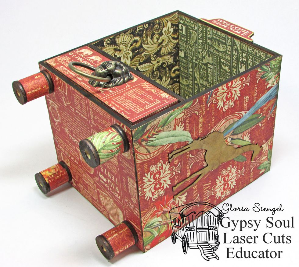 Glue one spool to each corner of the bottom of the case.