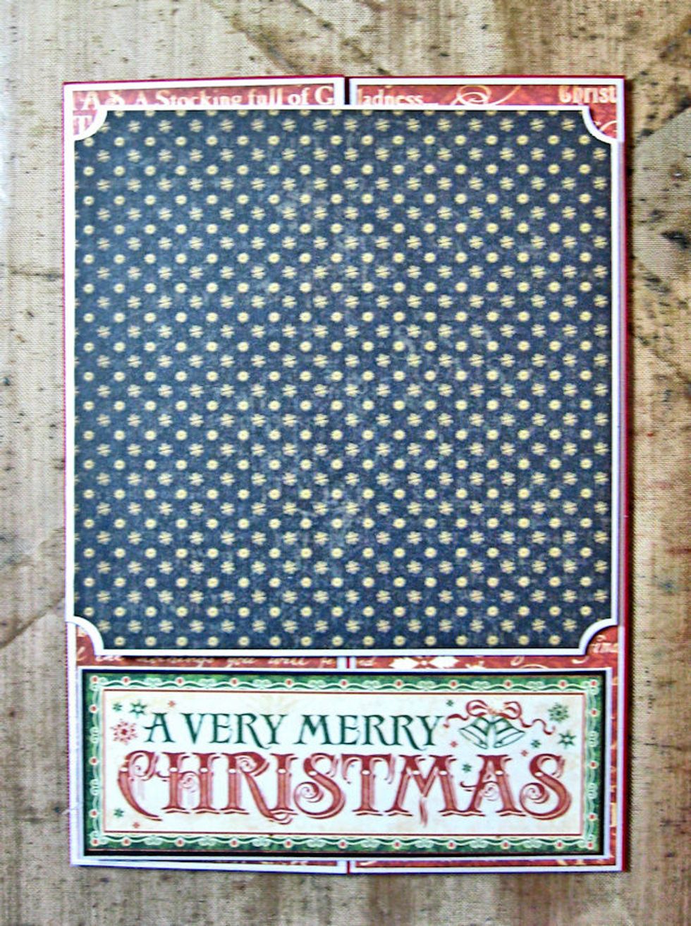Glue ONLY the right hand side of the sentiment to the right hand of the gate. Line the back with Kris Kringle paper for a finished look.