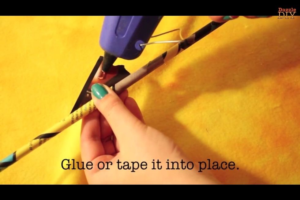 Glue or tape it into place