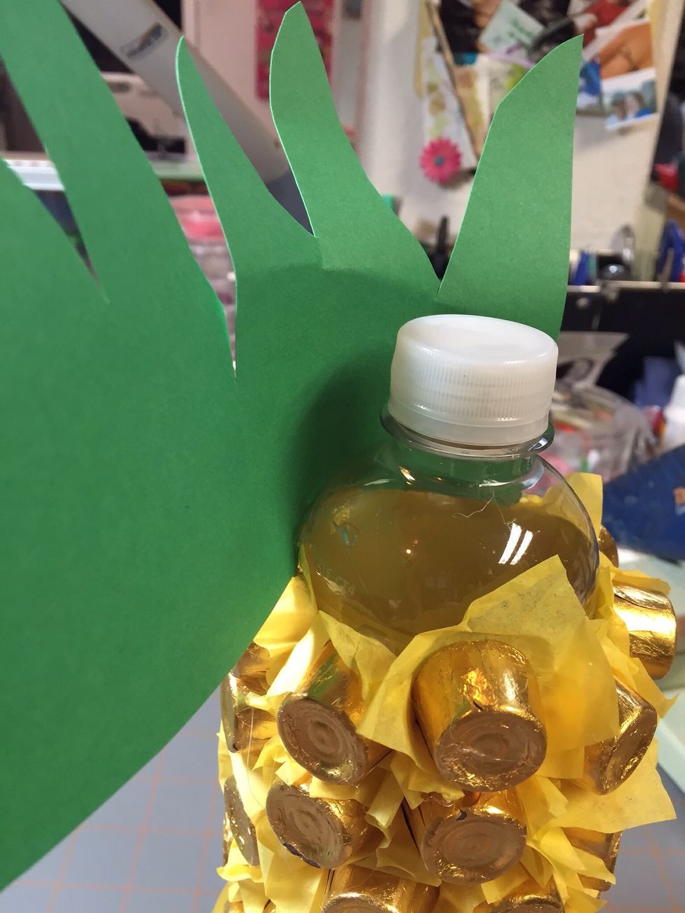 Glue paper stem around the top of the bottle.