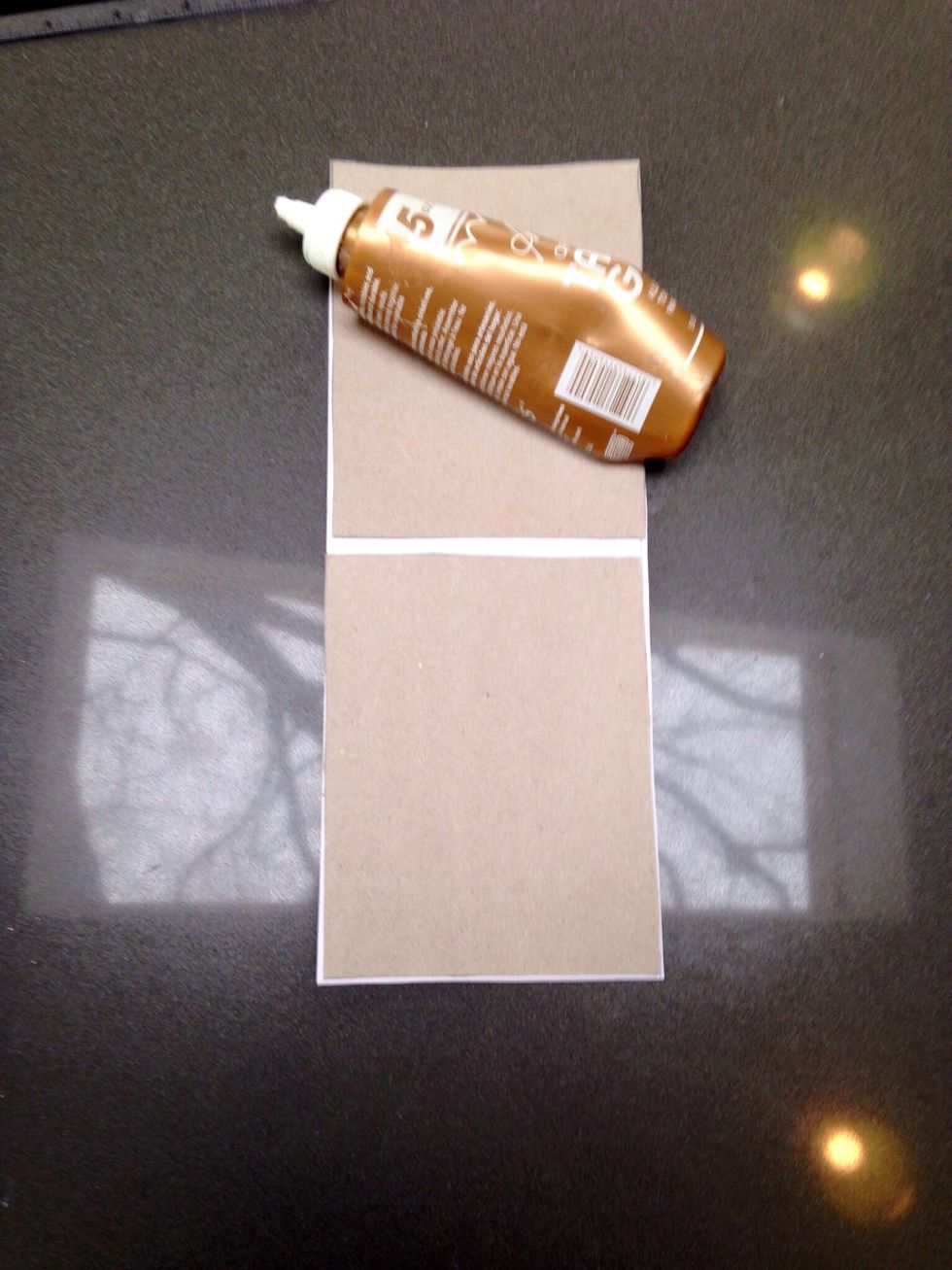 Glue paper to cardboard, leaving a gap between pieces.
