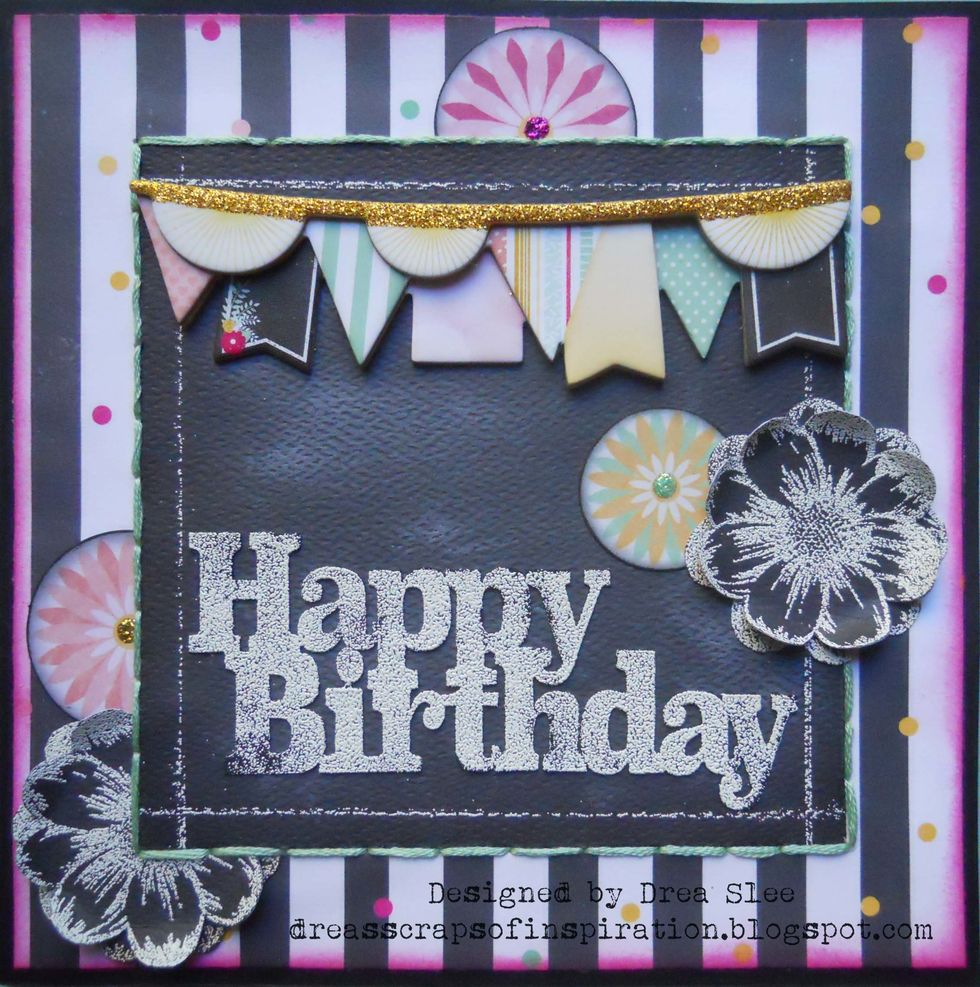 Glue pieces as shown, add banner from the Layered Chipboard, and, glue to a 6" card made from black cardstock. Find your supplies at www.fotobella.com. Tutorial by FotoBella Design Team Member Drea