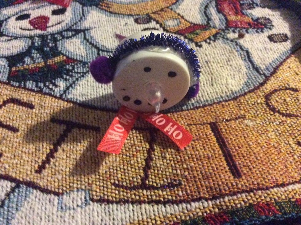 Glue ribbon on the bottom and on the back of tealight