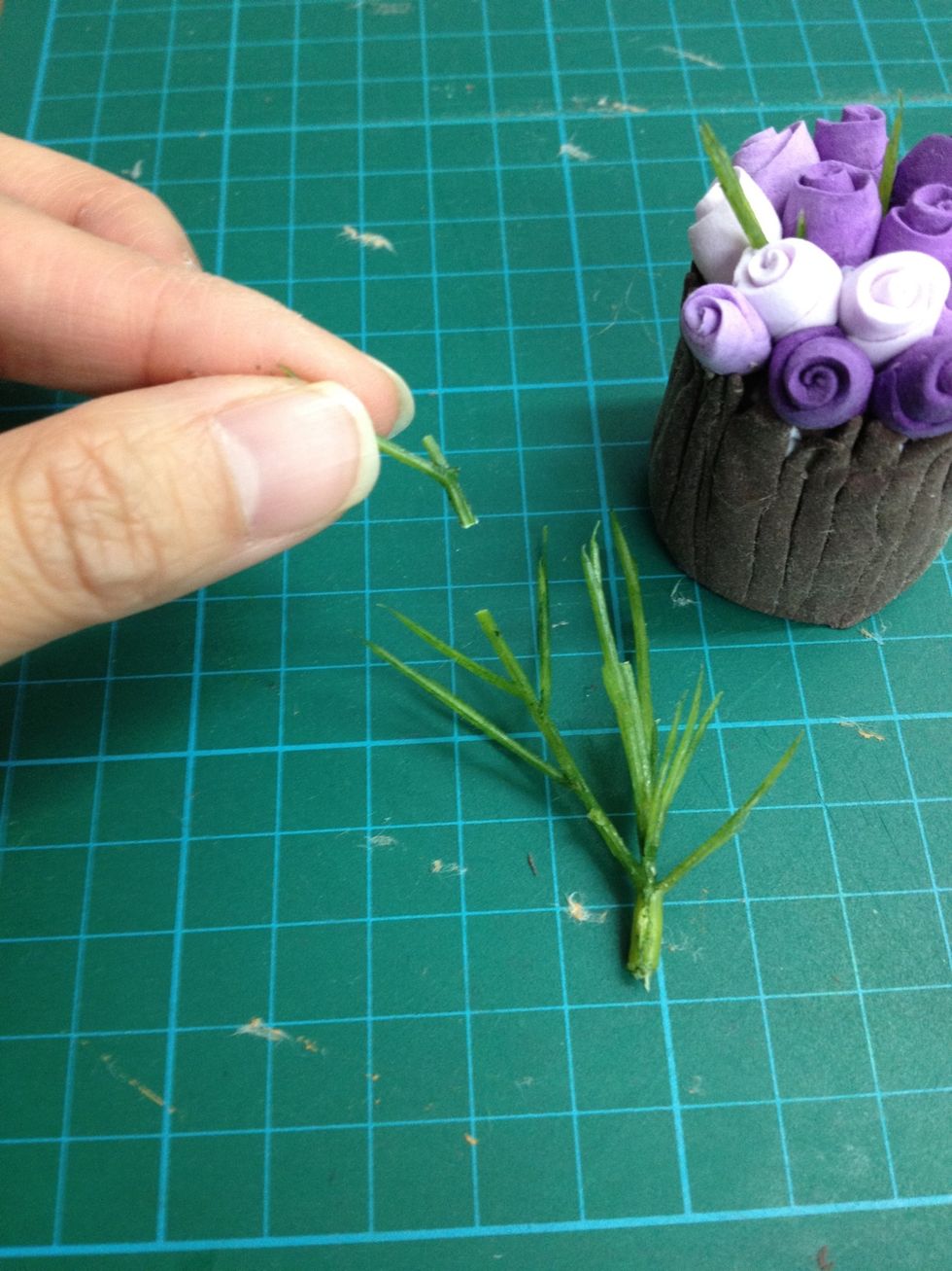 Glue some plastic leaves.