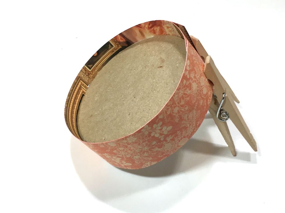 Glue the 12" strip to the lid lining the bottom of the paper up with the bottom of the lid. The excess paper should extend above the top of the lid.