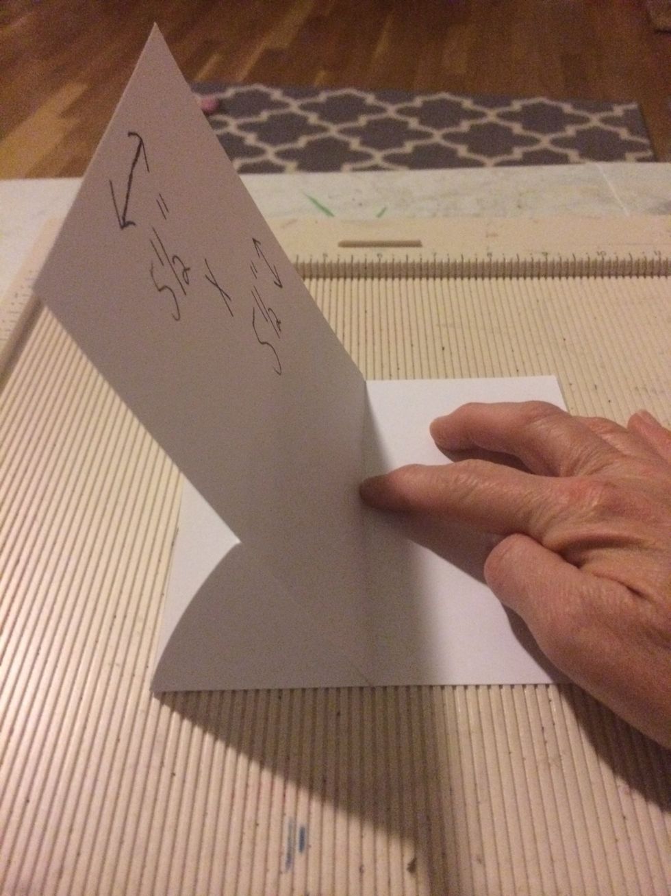 Glue the 5 1/2" x 5 1/2" piece of cardstock to the 2 3/4" fold of paper.